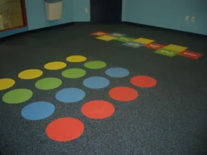 Dinoflex rubber tile with inlaid games for school
