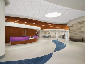 Healthcare facility with moisture resistant ceiling tiles