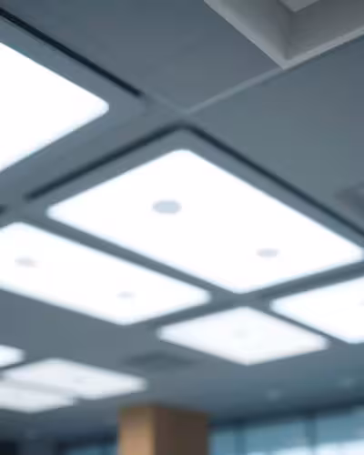 Modern acoustic ceiling tiles with integrated LED lighting panels