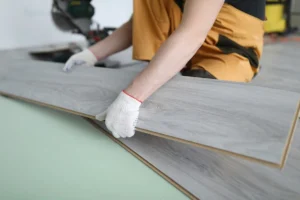 LVT Installation with plank tile being placed