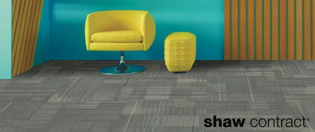 blue sofay with yellow chair on carpet